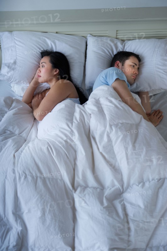 Couple in bed.