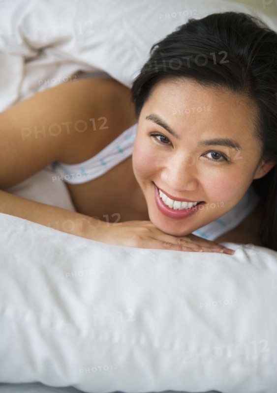Woman lying in bed.