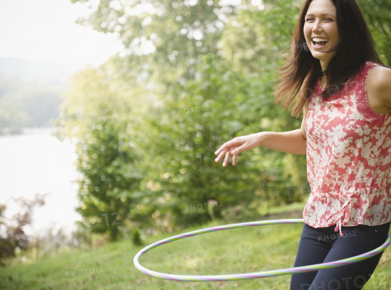 Roaring Brook Lake, Woman plying with hoopla hoop. Photo: Jamie Grill