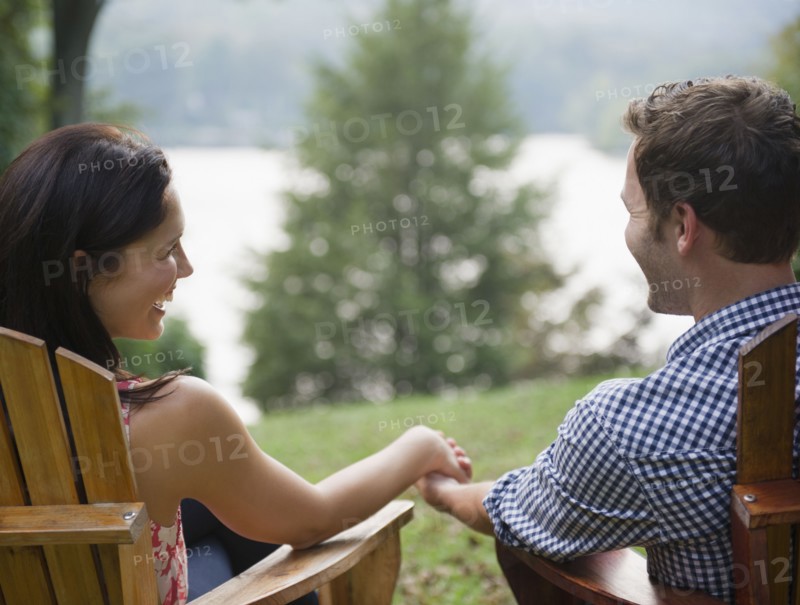 Roaring Brook Lake,  Close up of couple relaxing by lake. Photo: Jamie Grill