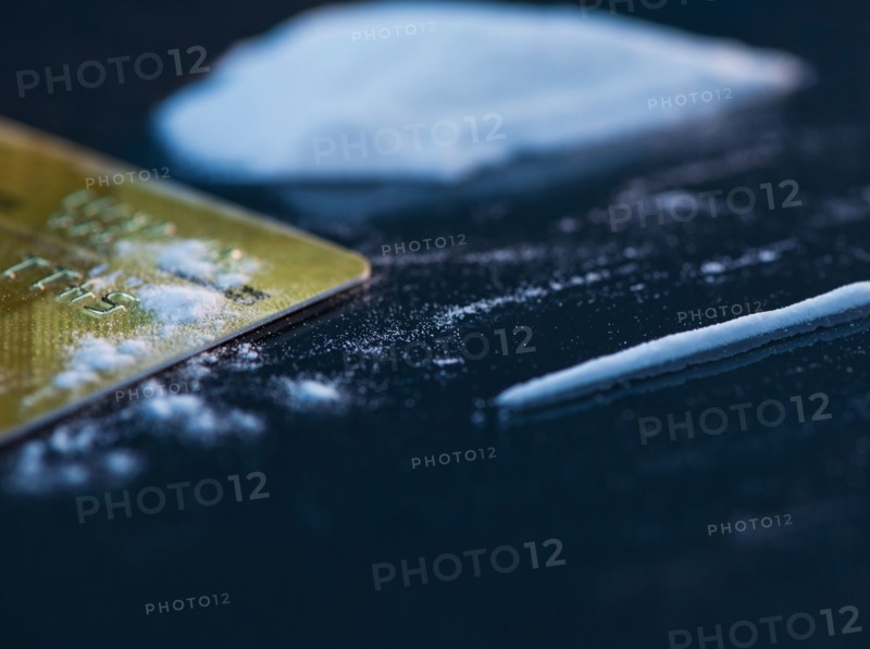 Close up of cocaine and credit card on black background. Photo : Daniel Grill