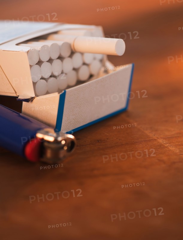 Close up of open cigarette pack and lighter. Photo: Daniel Grill