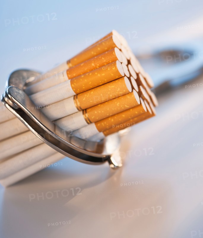 Close up of bunch of cigarettes locked in handcuffs. Photo: Daniel Grill