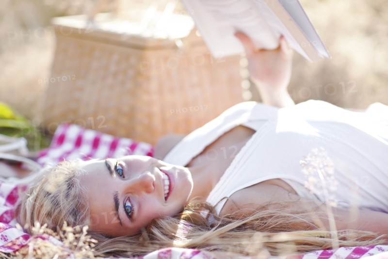 Happy teenage girl (16-17) relaxing outdoors. Photo : Take A Pix Media