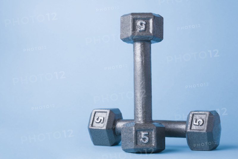 Studio shot of metal dumbbells. Photo : Kristin Lee