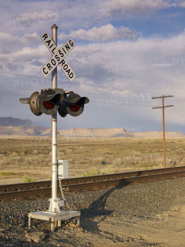 USA, Utah, Desert landscape with railroad crossing. Photo : John Kelly