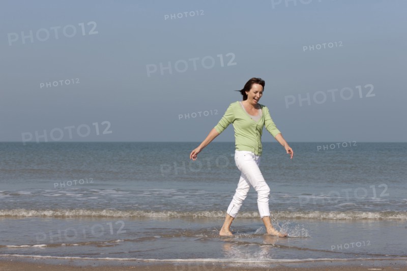 Woman on beach. Photo : Jan Scherders