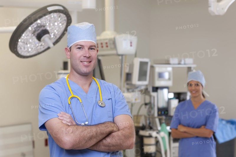 Portrait of male and female surgeons in operating room. Photo : db2stock