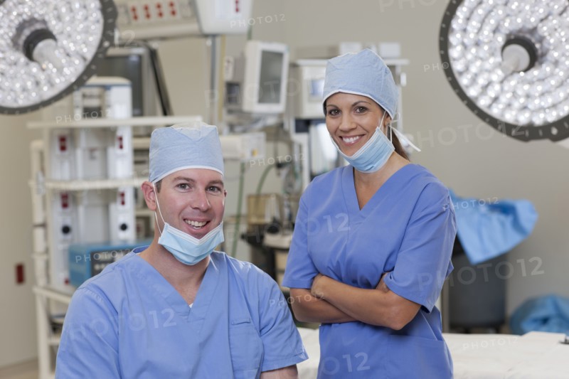 Portrait of male and female surgeons in operating room. Photo : db2stock