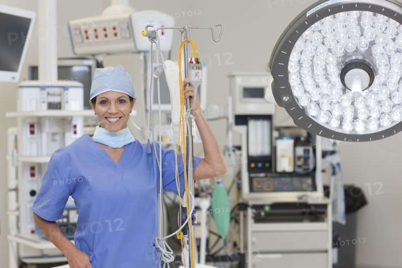 Portrait of female surgeon in operating room. Photo : db2stock