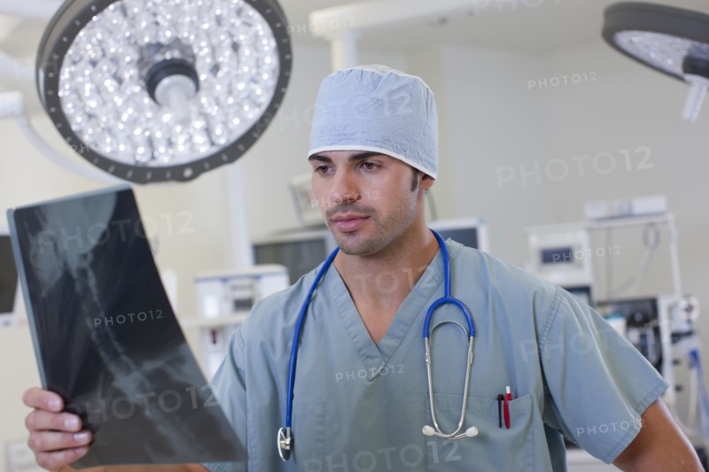 Doctor looking at x-ray. Photo: db2stock