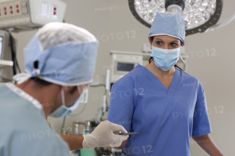 Surgeons in operating room. Photo : db2stock