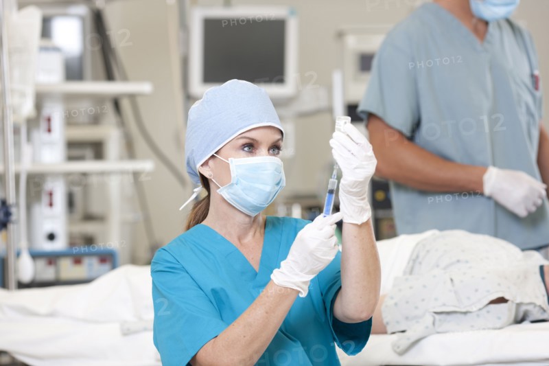 Surgeons preparing patient for surgery. Photo: db2stock