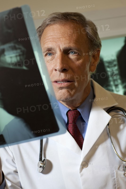 Doctor looking at x-ray. Photo: db2stock