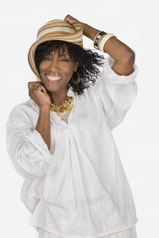 Studio portrait of mature woman wearing hat. Photo : Rob Lewine
