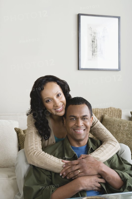 Portrait of couple at home. Photo : Rob Lewine