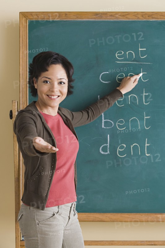 Teacher showing words on blackboard. Photo : Rob Lewine