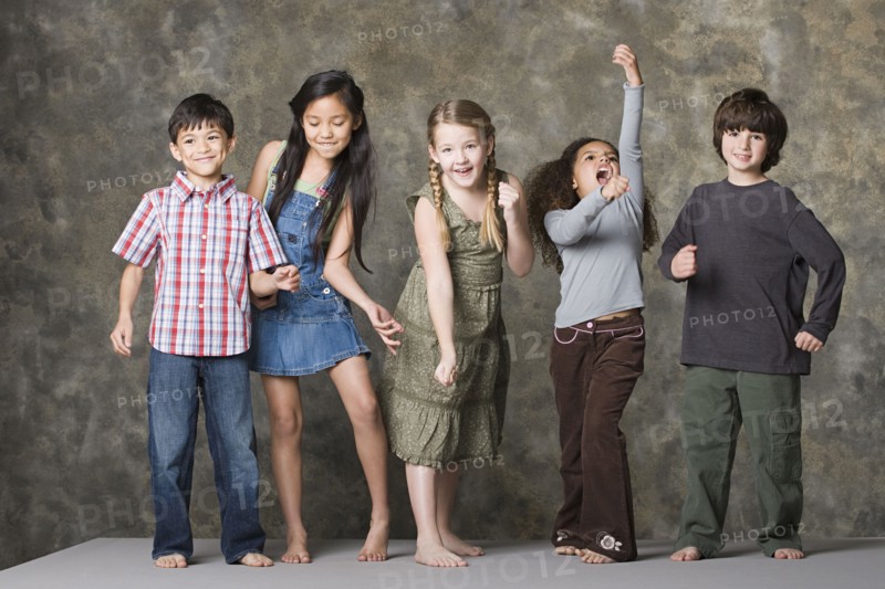 Children (6-7, 8-9) dancing together, studio shot. Photo : Rob Lewine