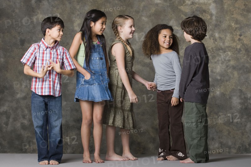 Children (6-7, 8-9) playing together, studio shot. Photo : Rob Lewine