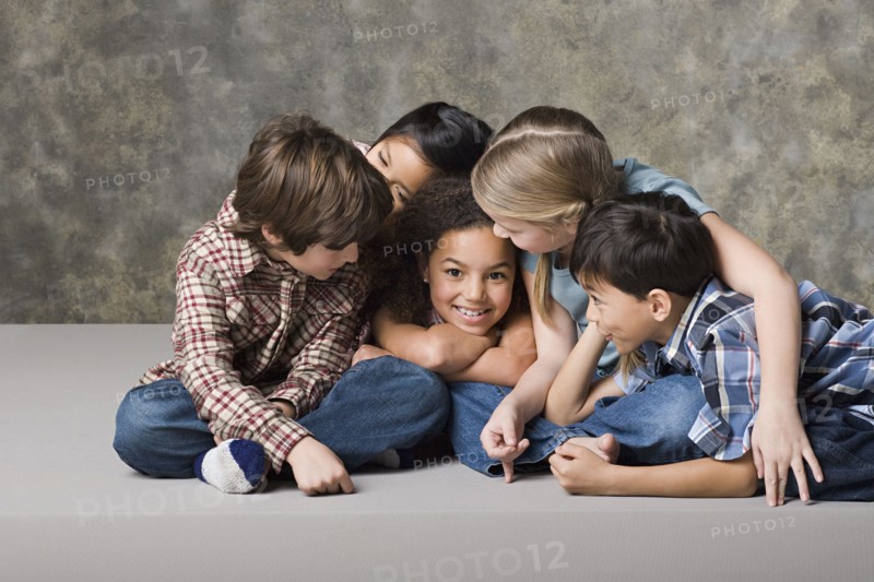 Children (6-7, 8-9) playing together, studio shot. Photo : Rob Lewine