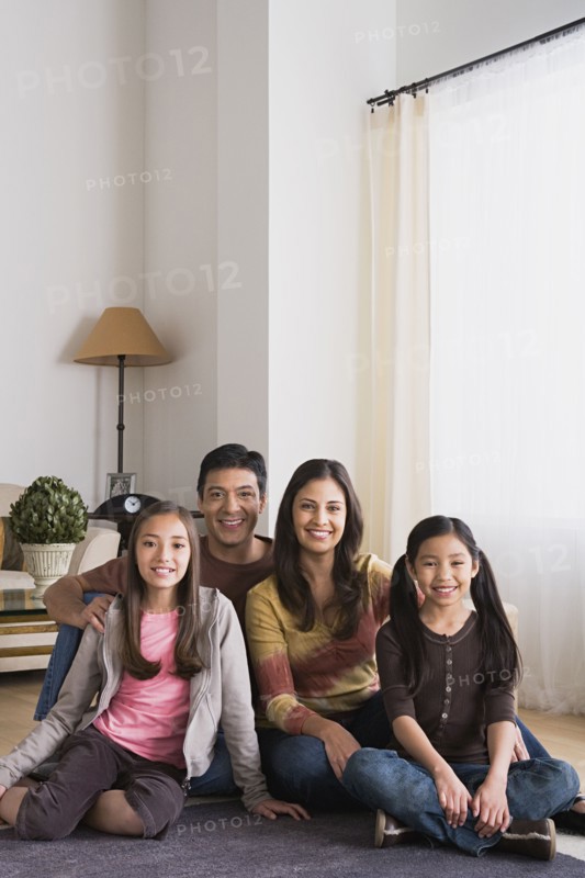 Portrait of family with two daughters (8-9, 10-11). Photo: Rob Lewine