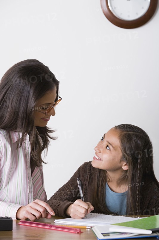Mother doing homework with daughter (10-11). Photo : Rob Lewine