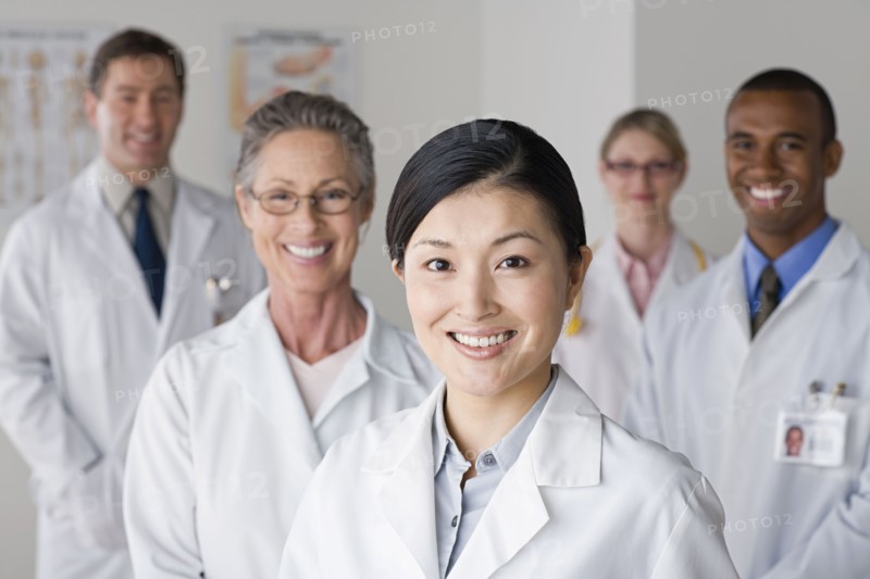 Group portrait of smiling doctors. Photo: Rob Lewine