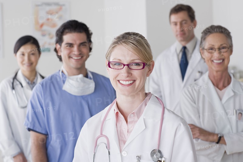 Group portrait of smiling doctors. Photo: Rob Lewine