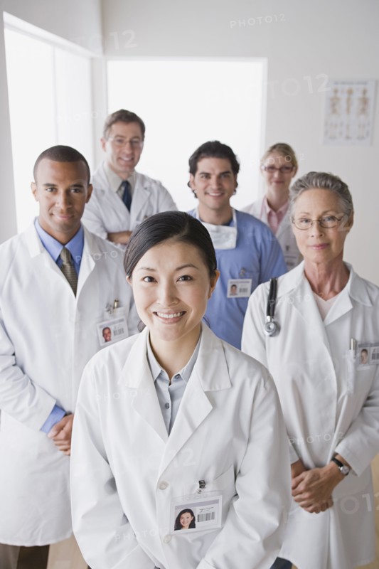 Group portrait of smiling doctors. Photo : Rob Lewine