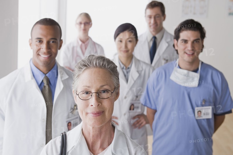 Group portrait of smiling doctors. Photo: Rob Lewine