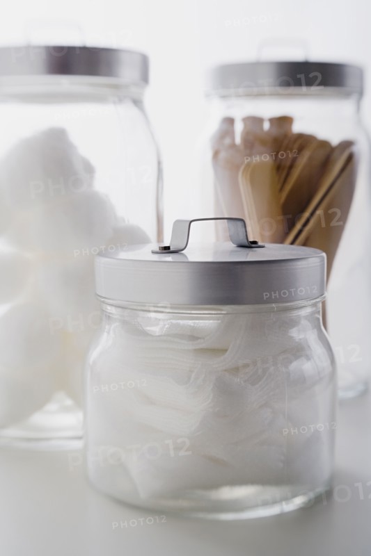 Close up of gauze and spatulas in jars studio shot. Photo : Rob Lewine