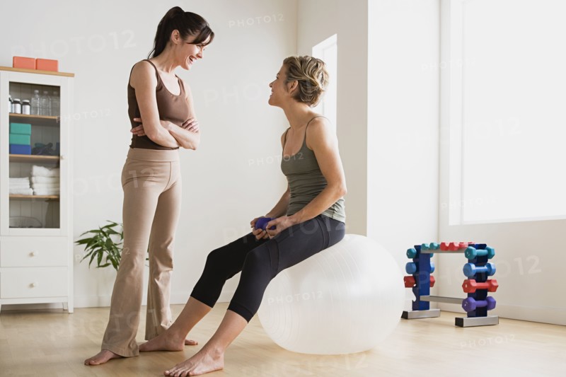 Women talking in gym. Photo : Rob Lewine