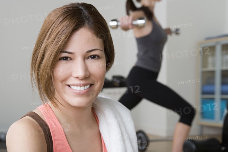 Two women exercising in gym. Photo : Rob Lewine
