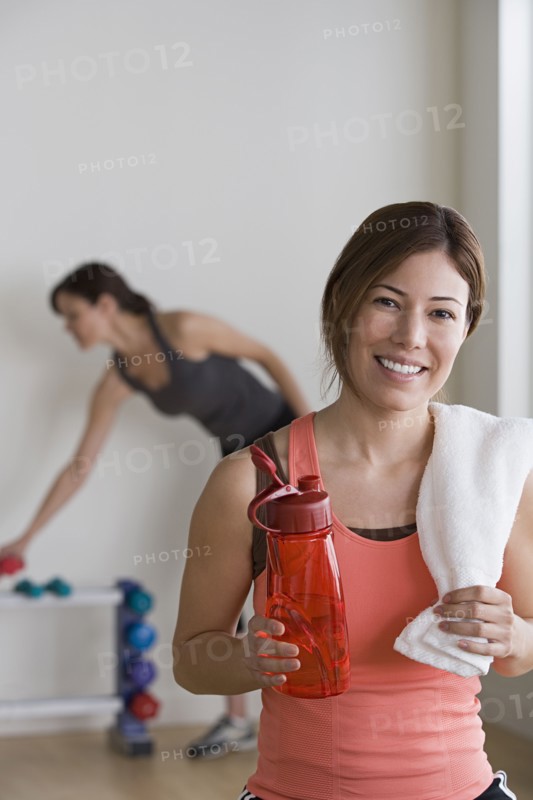 Two women exercising in gym. Photo : Rob Lewine