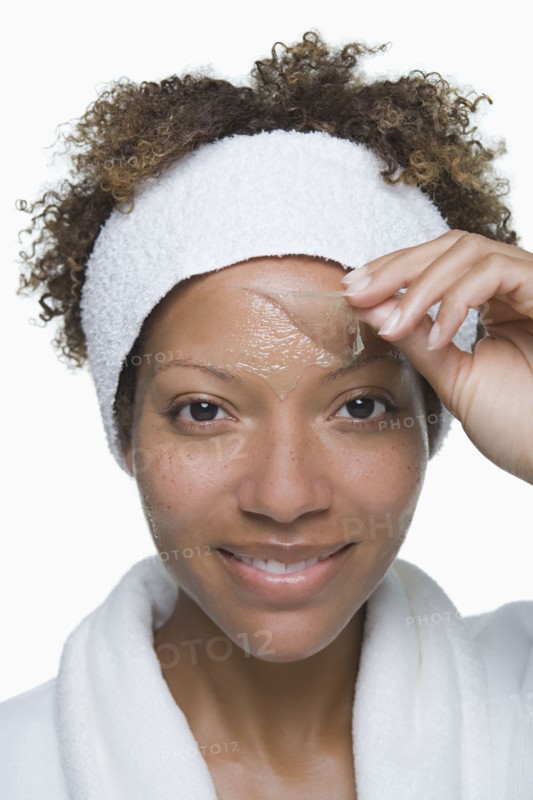 Portrait of attractive woman with facial mask. Photo: Rob Lewine