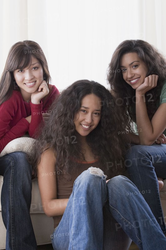 Portrait of three young women smiling. Photo: Rob Lewine