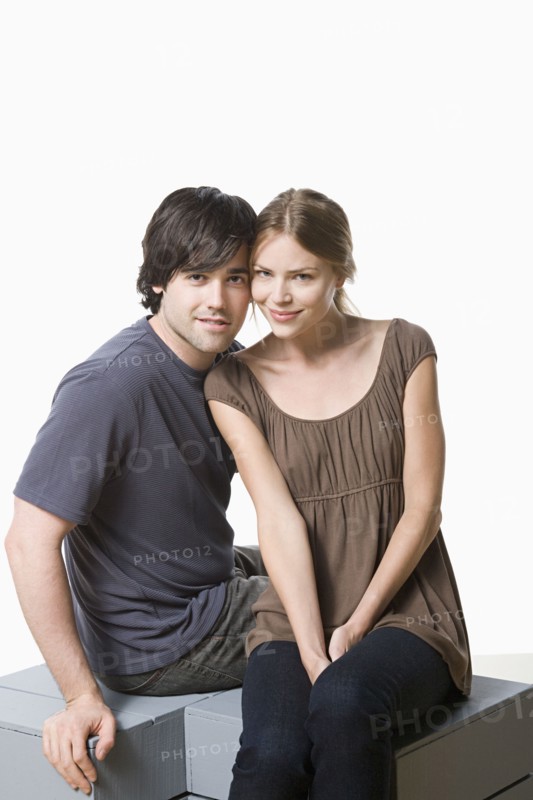 Studio portrait of young couple. Photo : Rob Lewine