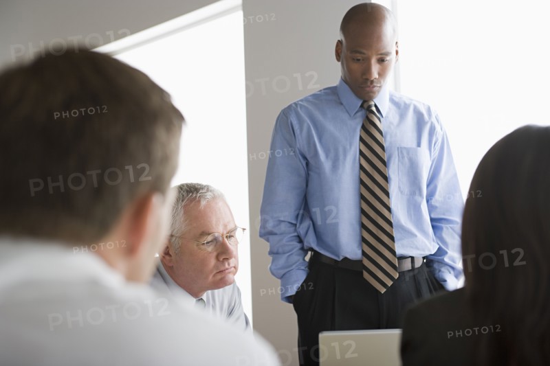 Businessmen in office. Photo : Rob Lewine