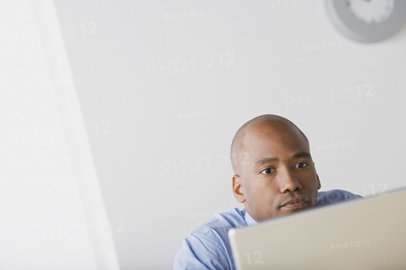 Businessman in office. Photo: Rob Lewine