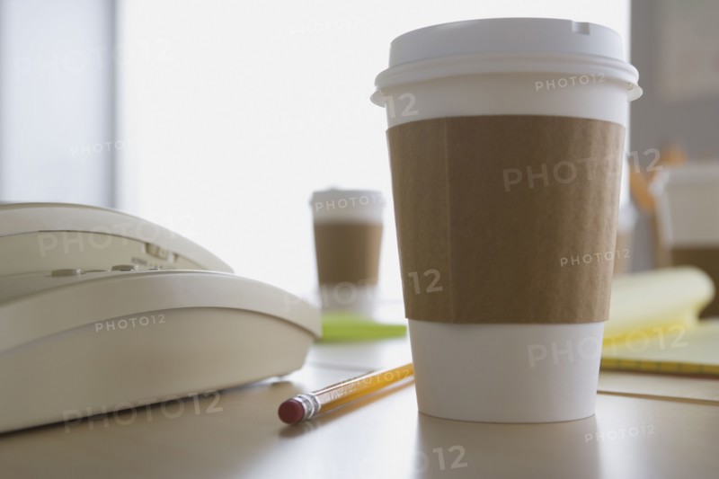 Plastic coffee cup on desk. Photo: Rob Lewine