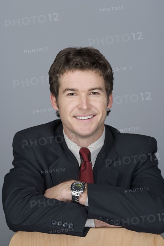 Portrait of happy young businessman. Photo: Rob Lewine