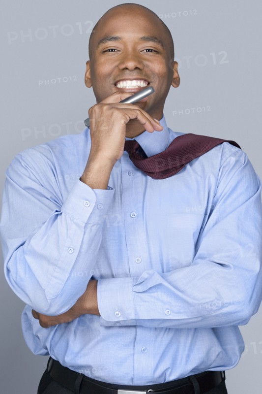 Portrait of mid adult businessman. Photo : Rob Lewine