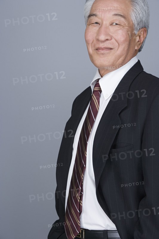 Portrait of happy senior businessman. Photo : Rob Lewine