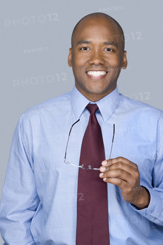 Portrait of mid adult businessman. Photo : Rob Lewine