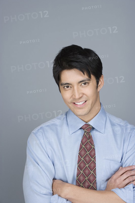 Portrait of happy young businessman. Photo : Rob Lewine