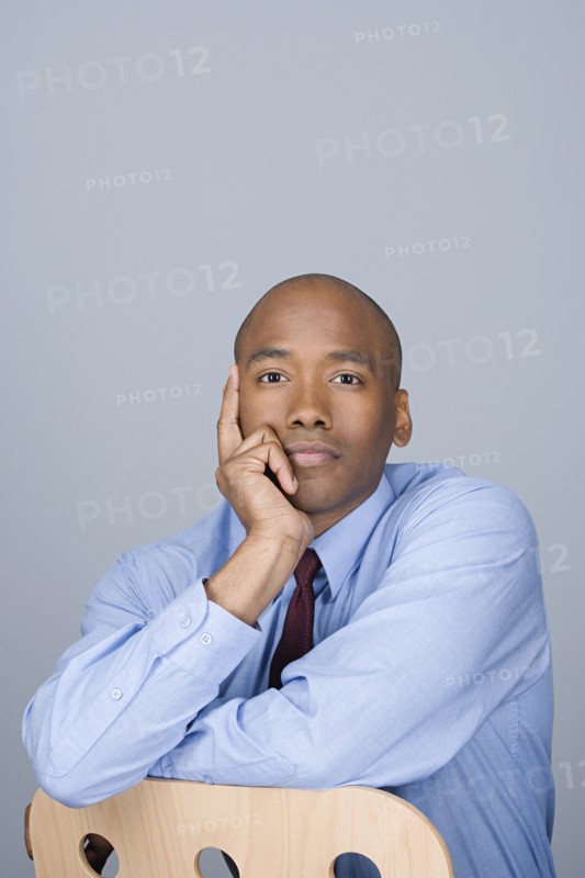 Portrait of happy mid adult businessman. Photo : Rob Lewine