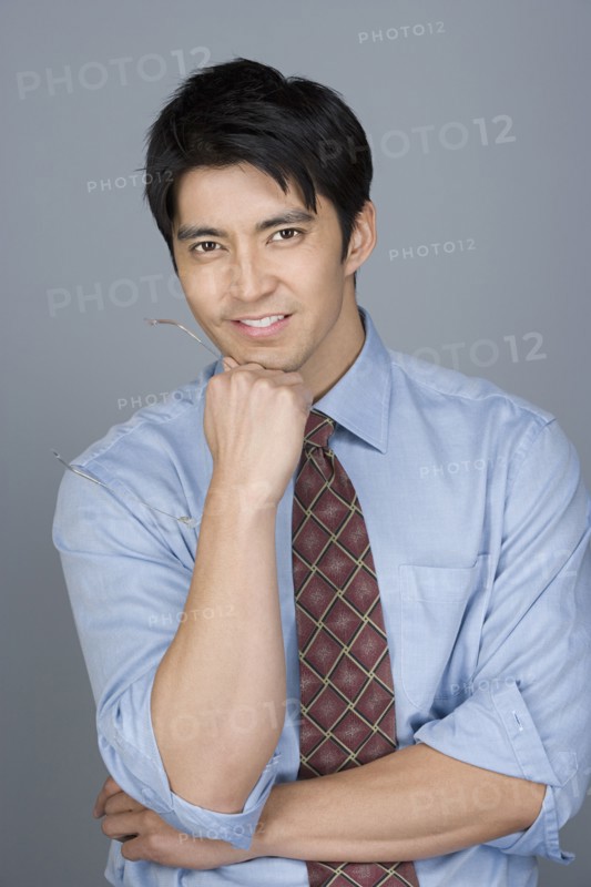 Portrait of happy young businessman. Photo : Rob Lewine