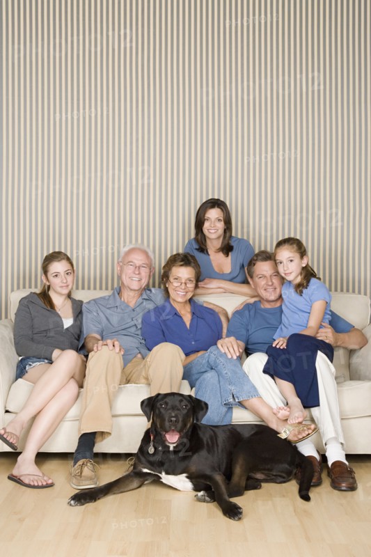 Portrait of three-generation family with two girls (8-9, 14-15) and dog. Photo : Rob Lewine