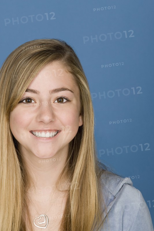 Portrait of happy teenage (14-15). Photo : Rob Lewine