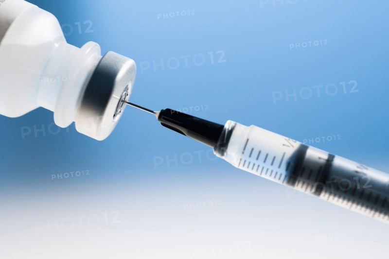 Studio shot of syringe and vial.